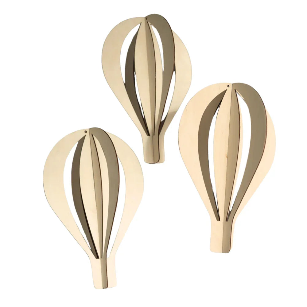 Three natural wood hot air balloon wall decor, laser-cut with slatted design for nursery or home accent.