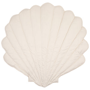 Light cream reverse side of the reversible Moi Mili shell playmat on a white background