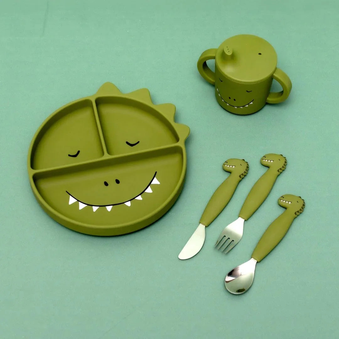 Green silicone dinosaur-themed sippy cup, plate, and cutlery set for toddlers