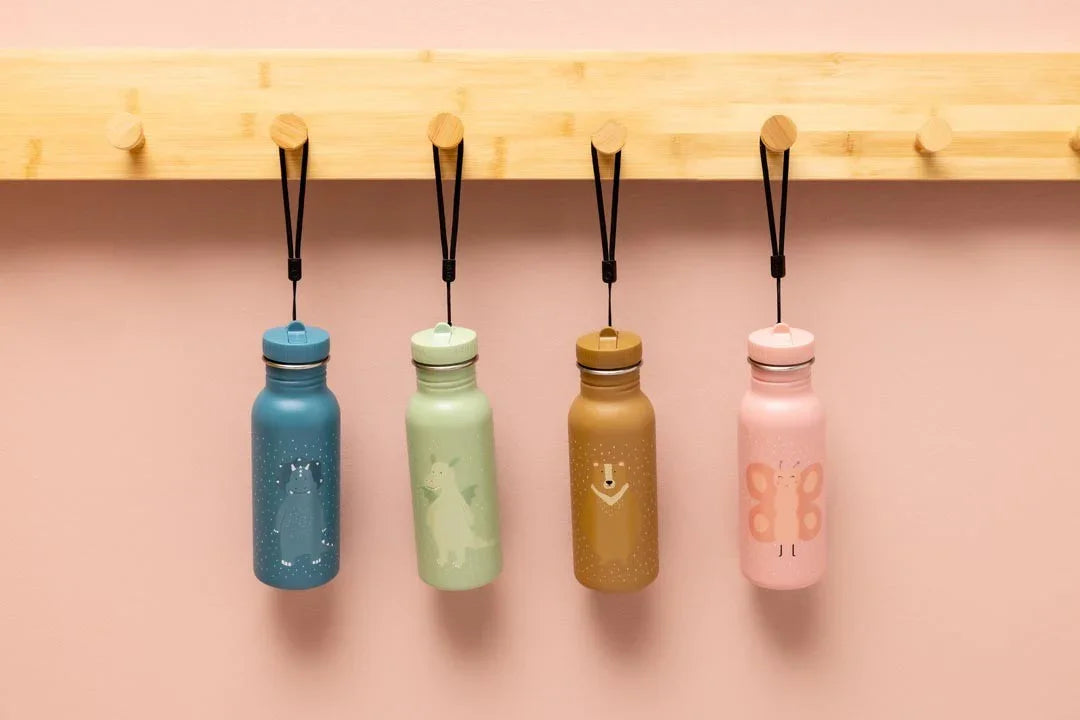 set of four stainless steel water bottles in blue, green, tan, and pink with animal patterns, hanging on a wooden rack