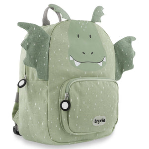 Three-quarter view of Trixie Mr. Dragon backpack showing green dragon wings, horns and large zipper pulls