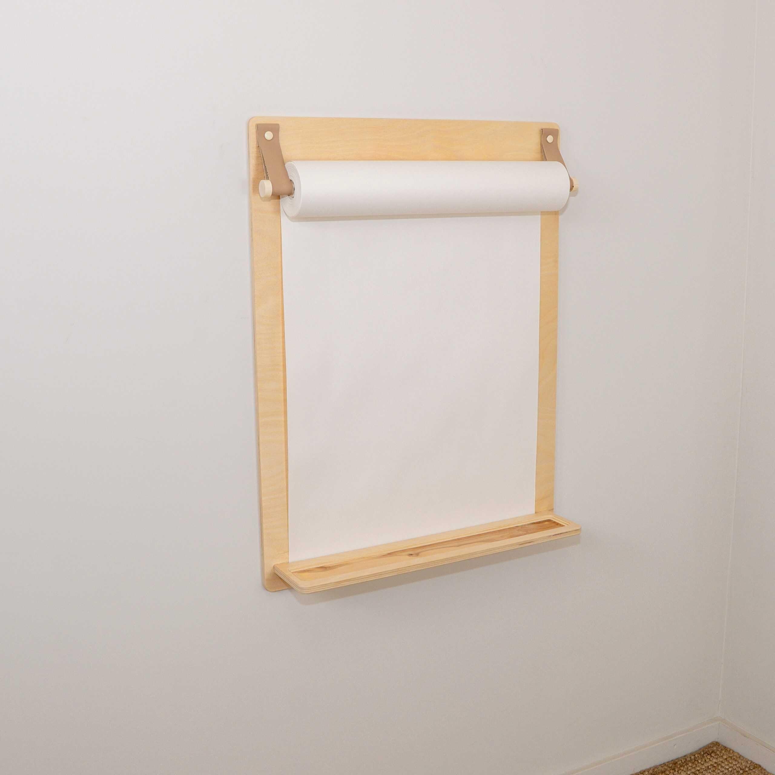 Light wood wall-mounted drawing paper roll holder with built-in shelf, ideal for nursery or kids' art space