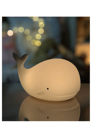 Veilleuse baleine en silicone diffusant une lueur douce pour décorer une chambre de bébé