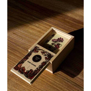 Wooden story blocks in floral box, handcrafted European nursery decor with botanical illustrations