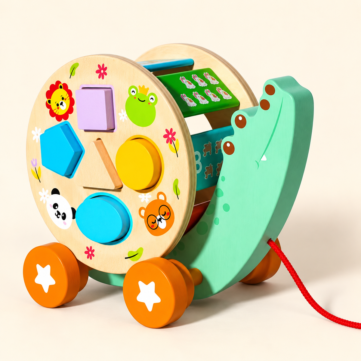 Wooden pull-along crocodile shape sorter with colourful geometric blocks, orange wheels and red pull cord