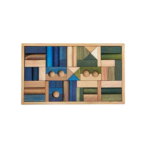 Wooden Story 54-piece cold colour wooden building blocks in blue green brown and natural tones arranged inside solid wooden storage box