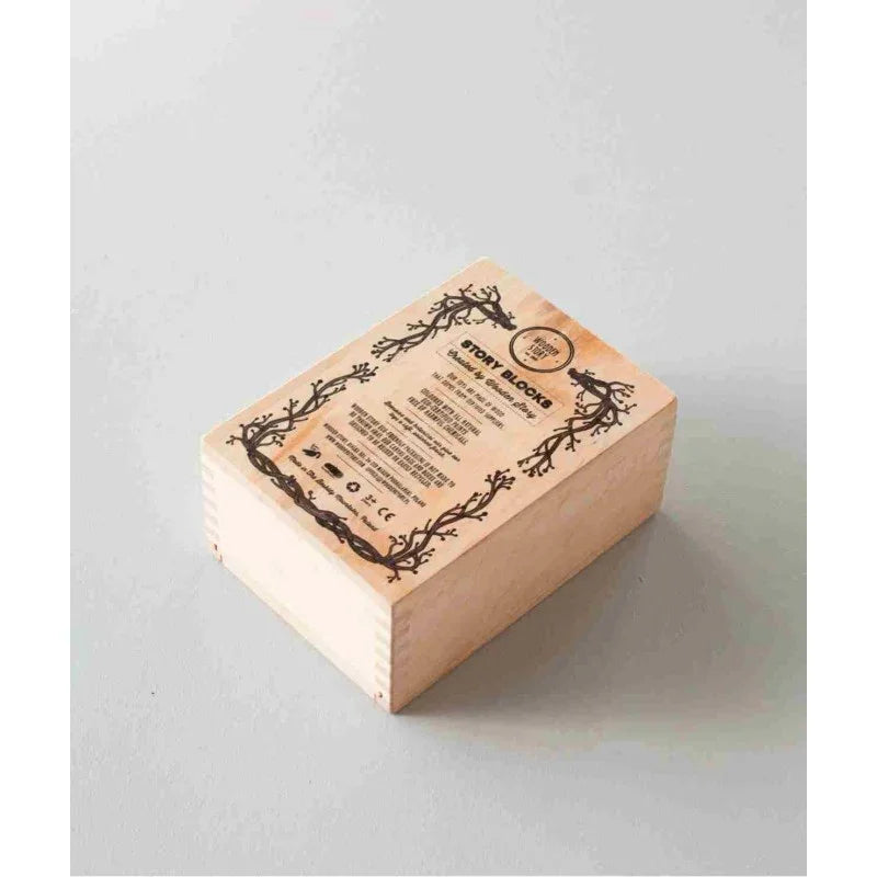 Natural wood story blocks box with engraved tree branch design, labeled 'Story Blocks' for nursery decor