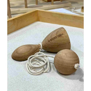 Close-up of natural wooden Swing and Catch game with wooden ball and cotton string