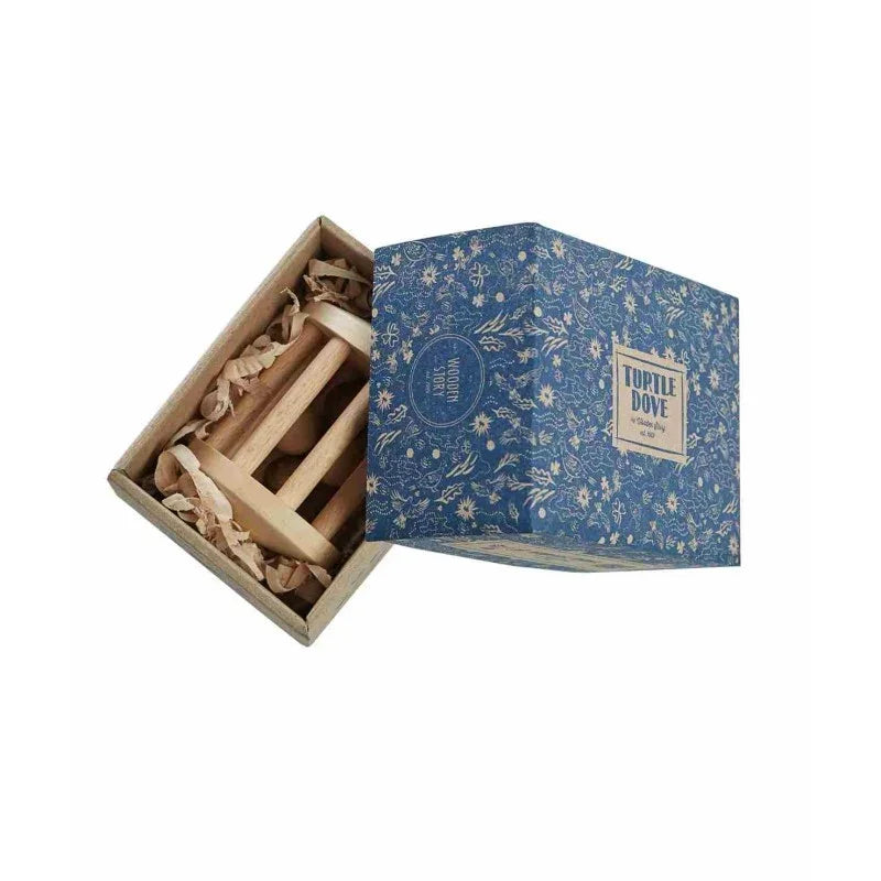Wooden Story Turtle Dove rattle presented inside its illustrated recyclable cardboard box
